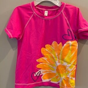 Joe Boxer - girls swim shirt.  size large.  Pink with flower.